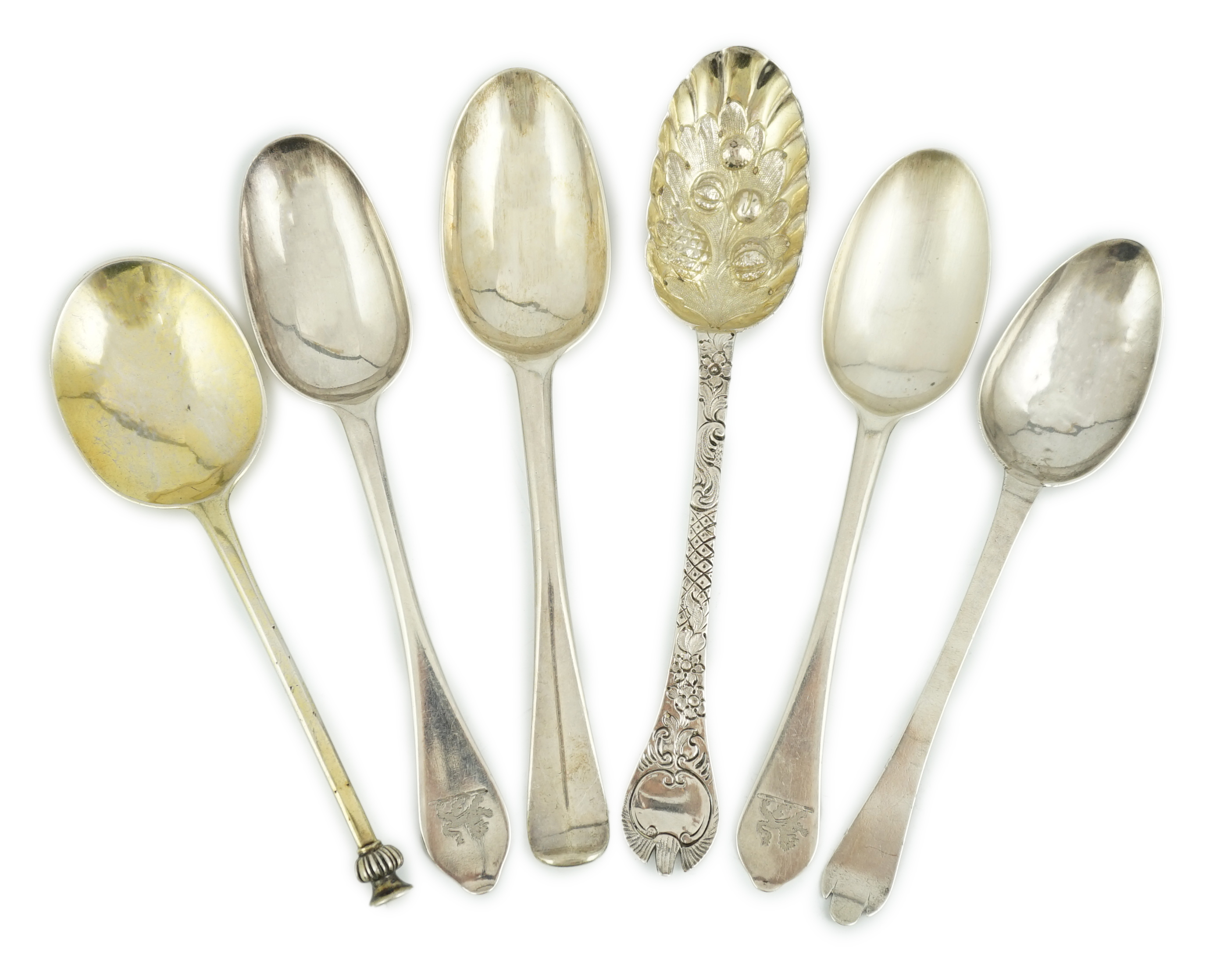 A George I provincial Brittania standard silver trefid spoon, later decorated as a berry spoon, Edmond Richard, Exeter, 1713, 21cm, together with five other 18th century spoons